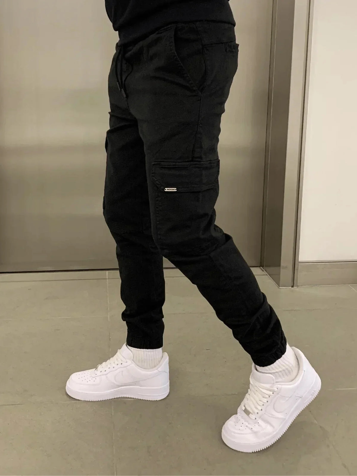 Comfortable Loose Fit Black Cargo Pants for Women with Practical Pockets and Elastic Waistband-2
